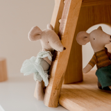 Mouse climbing up ladder of two storey cottage doll house from QToys