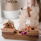 Girl playing with pirate ship from QToys