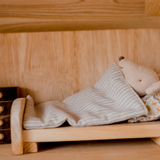 Mouse lying in bed inside two storey cottage house from QToys
