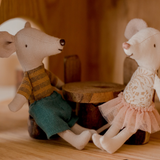 Two mice sitting at table in two storey cottage house of QToys