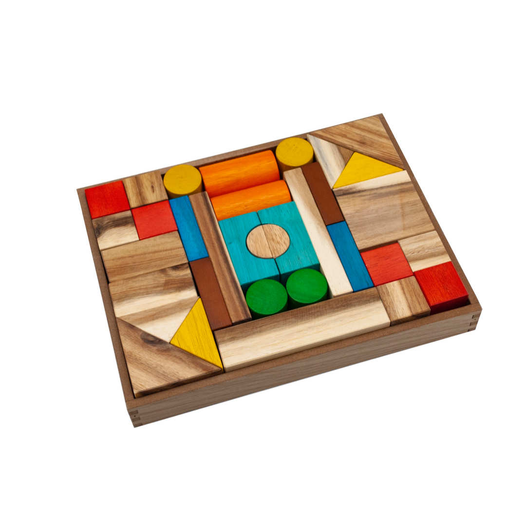 Natural colour wooden block set complete with 34 pieces from QToys. Displayed in an open wooden storage box. Colours consist of red, yellow, orange, turquoise, green, brown