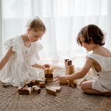 Children playing with building blocks from QToys