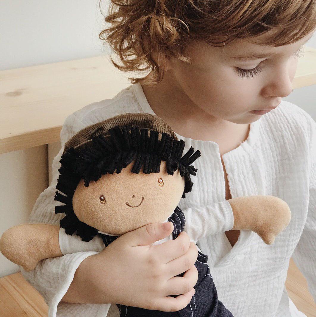 Bonikka Joe being cuddled by a small child