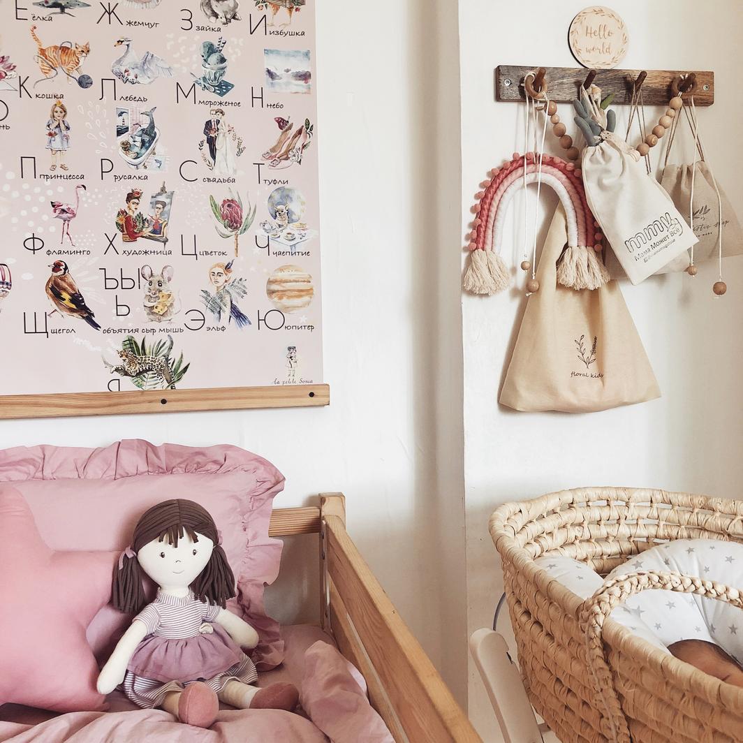 Brook doll in a cot in a beautifully decorated nursery room