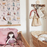 Brook doll in a cot in a beautifully decorated nursery room