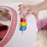 Activity beads in tray of Hape stroller