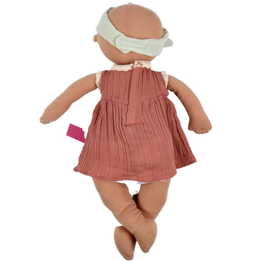 Back view of baby Aria showing Velcro fastening of dress and headband