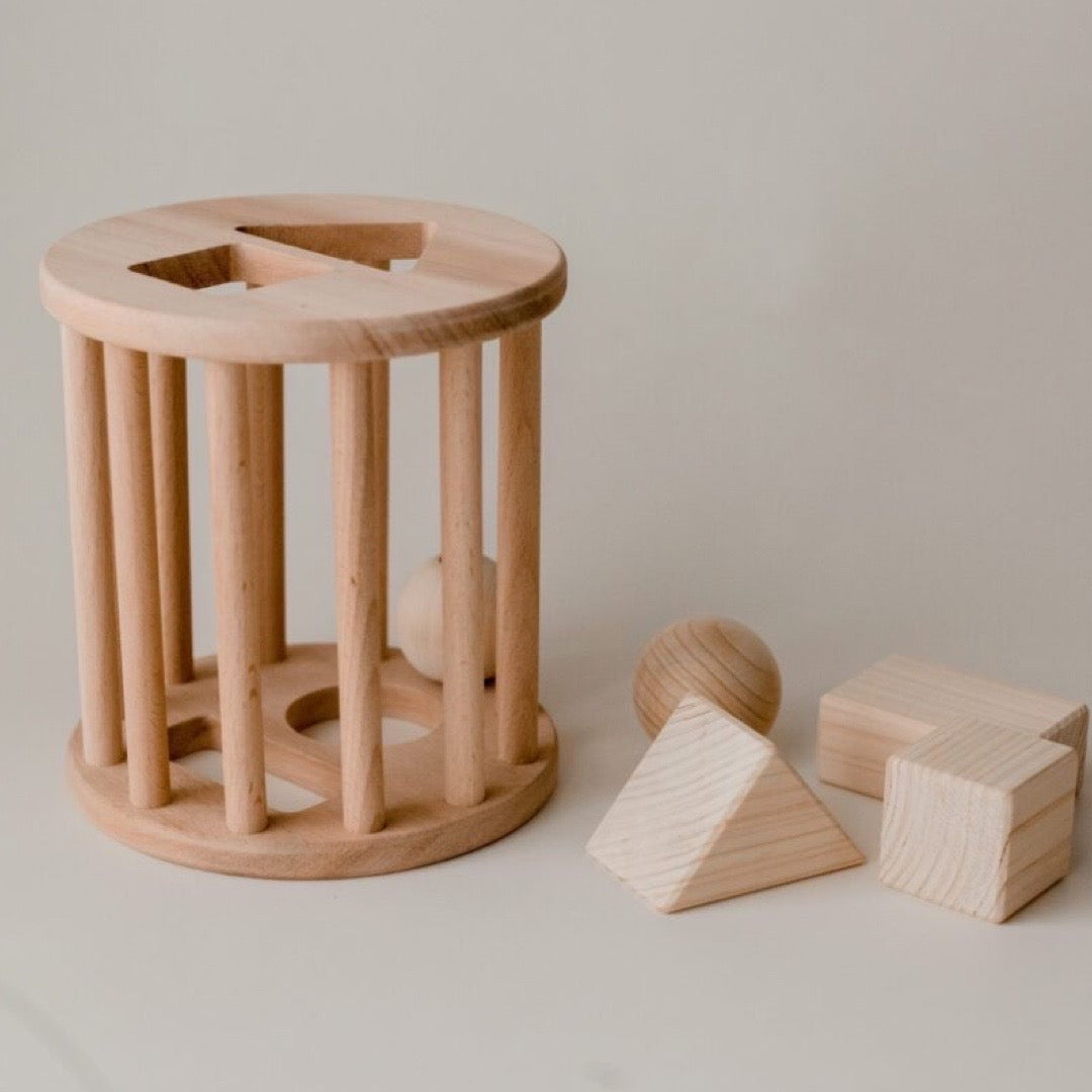 Wooden shape sorter from QToys. So plate with 3-Dimensional shapes