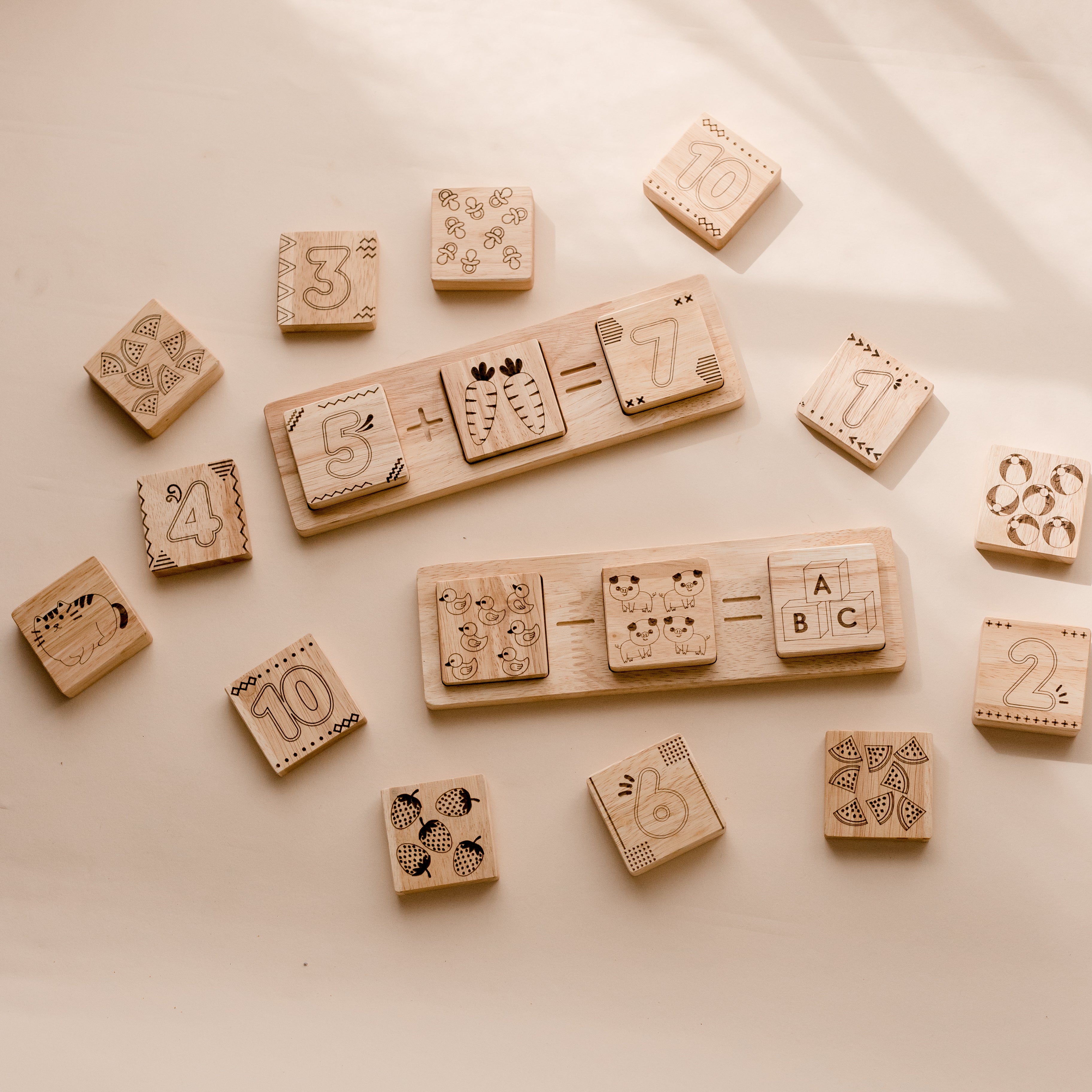 Wooden two piece math frame from QToys. Tiles with numbers on one side and pictures on the other