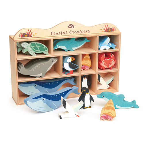 10 vibrant rubber wood ocean creature figurines in a beautiful wooden display shelf.  Includes Sea Turtle, Dolphin, Flying Fish, Seal, Puffin, Hermit Crab, Crab, Whale, Penguin, Seagull. 