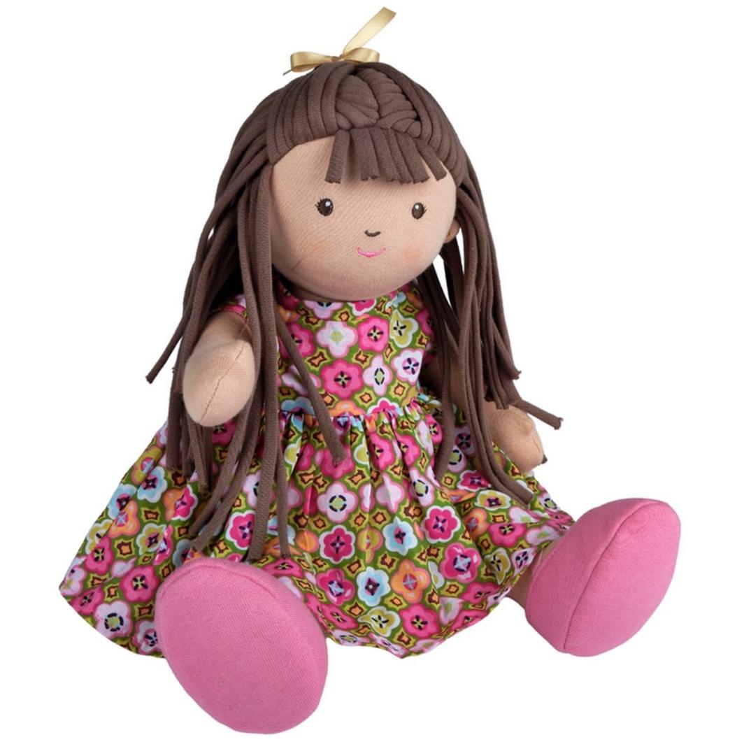 Bonikka Sofia doll with movable limbs. Fabric rag doll with brown hair and brown eyes. Wearing a floral dress and pink shoes which are removable.